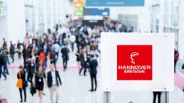 Blurred business people at a trade fair / hannover messe